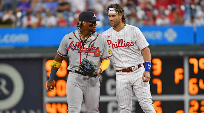 Braves’ Ronald Acuña Jr. and Phillies’ Bryce Harper chat.